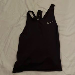 Great condition Nike workout top. Navy in color. Open back.